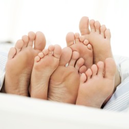 Soles of a Couple and Their Child --- Image by © Royalty-Free/Corbis
